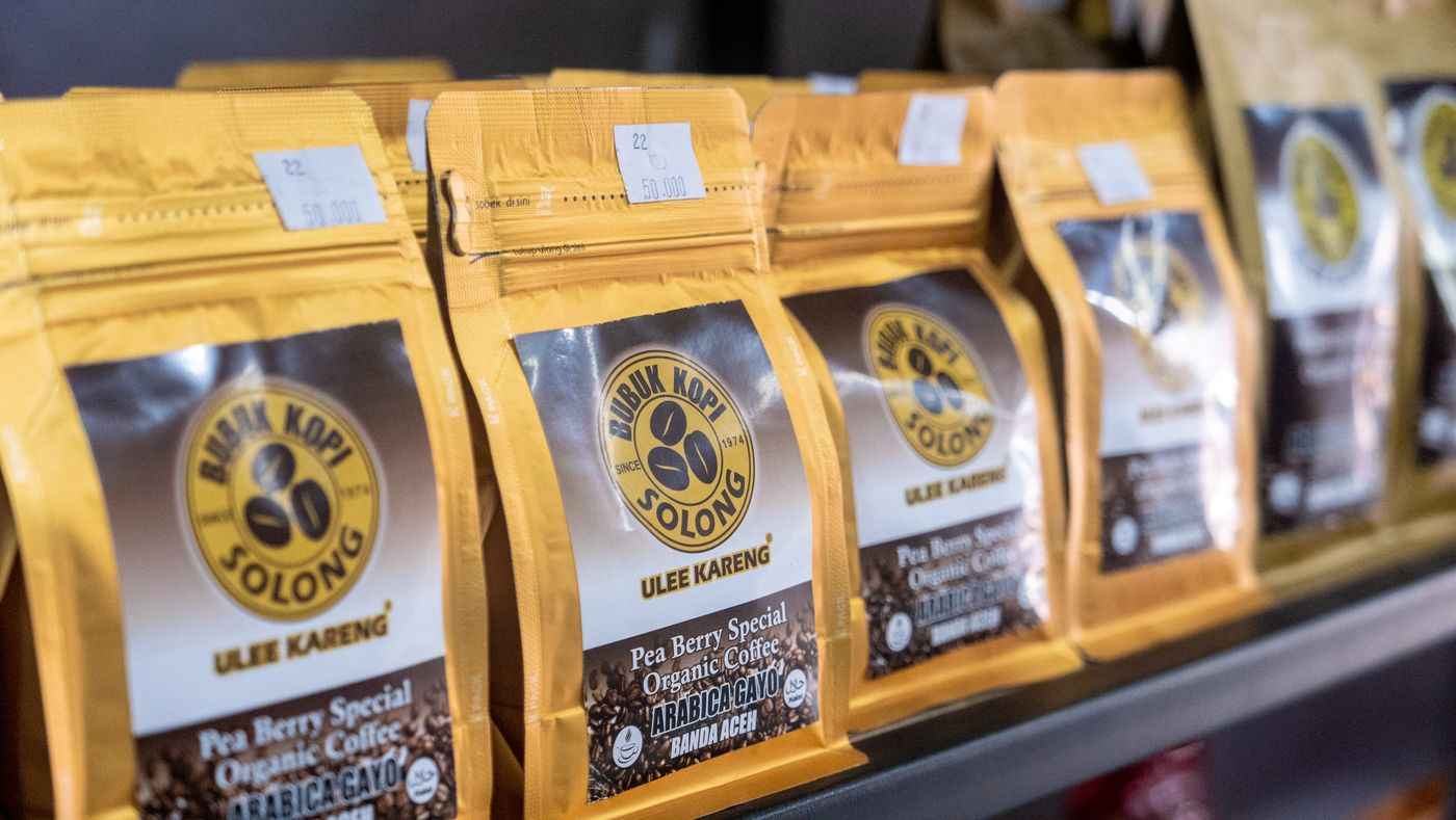 Labelled coffee bags on a shelf